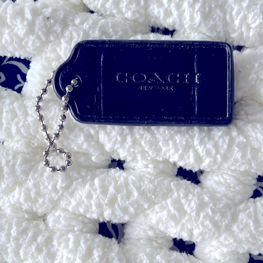 Coach black‎ NY leather hang tab. Textured. NWOT